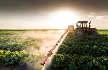 Fertilizer being sprayed over agriculture field